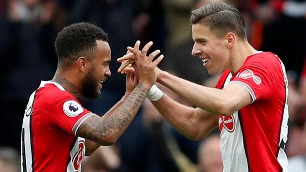 Southampton's Nathan Redmond and Jan Bednarek celebrate after their win over AFC Bournemouth.(REUTERS)