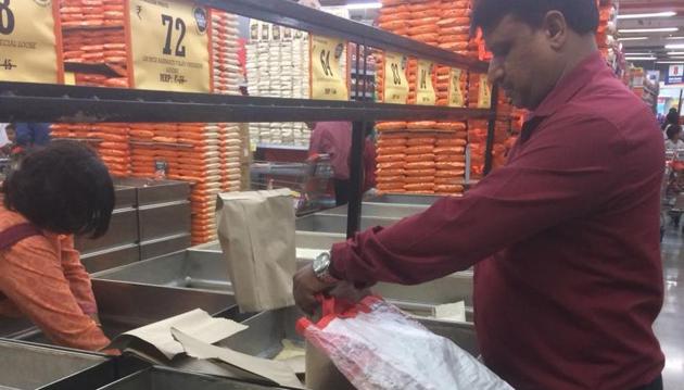 A Big Bazaar official said that while most of the stores in the city have started using new bags, remaining stores will also have paper bags in place in the next three days.(HT PHOTO)