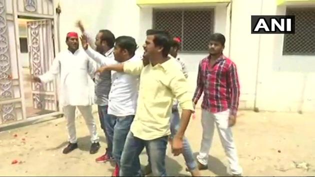 Youths, some of them wearing red caps, mobbed the minister’s official residence in high-security Kalidas Marg area here on Saturday, raising slogans and damaging his name plate. (ANI File Photo) Youths, some of them wearing red caps, mobbed the minister’s official residence in high-security Kalidas Marg area here on Saturday, raising slogans and damaging his name plate. (ANI File Photo)