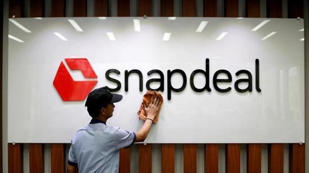 An employee cleans a Snapdeal logo at its headquarters in Gurugram on the outskirts of New Delhi. (Reuters File) An employee cleans a Snapdeal logo at its headquarters in Gurugram on the outskirts of New Delhi. (Reuters File)