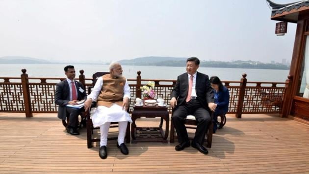 Prime Minister Narendra Modi speaks with Chinese President Xi Jinping as they take a boat ride on the East Lake in Wuhan, China. (PIB / REUTERS) Prime Minister Narendra Modi speaks with Chinese President Xi Jinping as they take a boat ride on the East Lake in Wuhan, China. (PIB / REUTERS)