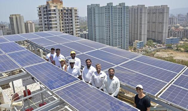 Residents attend the inauguration of the solar panel installation at Bhoomi Park (Phase 4 ) L wing in Malad on April 22.(Ragul Krishnan/ HT)