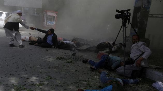 Afghan journalists are seen after a blast in Kabul, Afghanistan on April 30, 2018. (Reuters Photo) Afghan journalists are seen after a blast in Kabul, Afghanistan on April 30, 2018. (Reuters Photo)