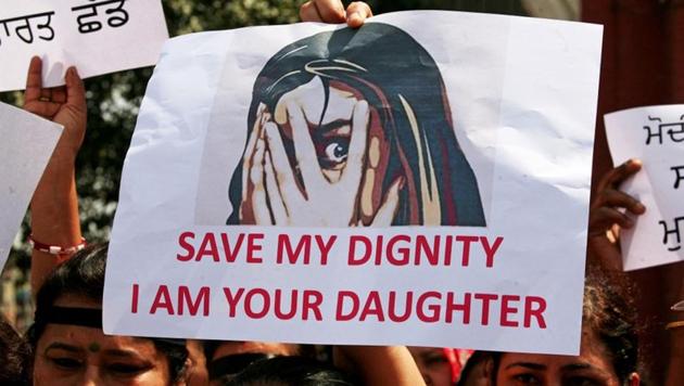 People participate in a protest against crimes against women, in Amritsar. (REUTERS FILE)