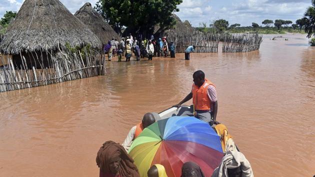 A rescue boat evacuates villagers from their homes, which have been submerged by floods following prolonged heavy rains in Tana Delta, coastal Kenya. (AP File Photo) A rescue boat evacuates villagers from their homes, which have been submerged by floods following prolonged heavy rains in Tana Delta, coastal Kenya. (AP File Photo)