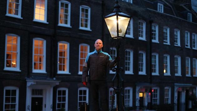 Iain Bell is gas lamp lighter engineer from British Gas, in London, England. 1,500 gas lamps, some of which are 200 years old, continue to light some secret and beautiful corners of the British capital and are maintained by hand by a five-man team, supervised by Bell. (Daniel Leal-Olivas / AFP)
