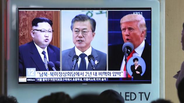 People watch a TV screen showing file footage of US President Donald Trump, right, South Korean President Moon Jae-in and North Korean leader Kim Jong Un, left, during a news program at the Seoul Railway Station in Seoul, South Korea, Wednesday, April 18, 2018. (AP Photo) People watch a TV screen showing file footage of US President Donald Trump, right, South Korean President Moon Jae-in and North Korean leader Kim Jong Un, left, during a news program at the Seoul Railway Station in Seoul, South Korea, Wednesday, April 18, 2018. (AP Photo)