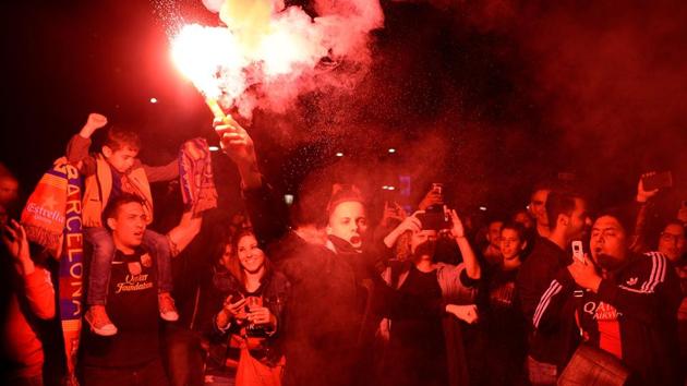 FC Barcelona football fans celebrate the club’s 25th La Liga title victory in Barcelona on Sunday. (AFP) FC Barcelona football fans celebrate the club’s 25th La Liga title victory in Barcelona on Sunday. (AFP)