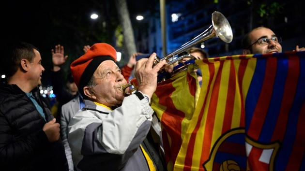 FC Barcelona fans celebrate the La Liga crown in Barcelona on Sunday night. (AFP) FC Barcelona fans celebrate the La Liga crown in Barcelona on Sunday night. (AFP)