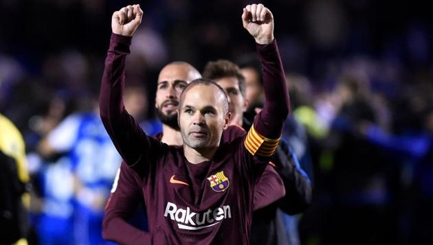 FC Barcelona's Andres Iniesta celebrates after his team won the Spanish La Liga beating Deportivo La Coruna on Sunday. (AFP) FC Barcelona's Andres Iniesta celebrates after his team won the Spanish La Liga beating Deportivo La Coruna on Sunday. (AFP)
