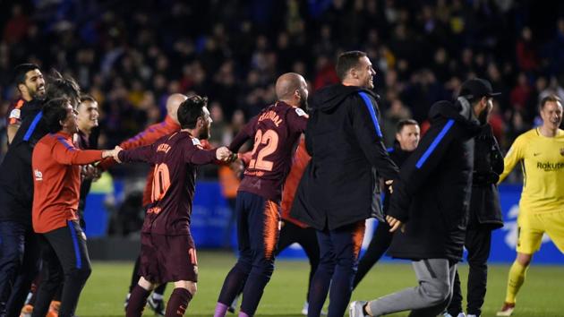 FC Barcelona players rejoice after winning the Spanish league football match against Deportivo Coruna and claiming their 25th La Liga at the Riazor stadium in Coruna.(AFP)