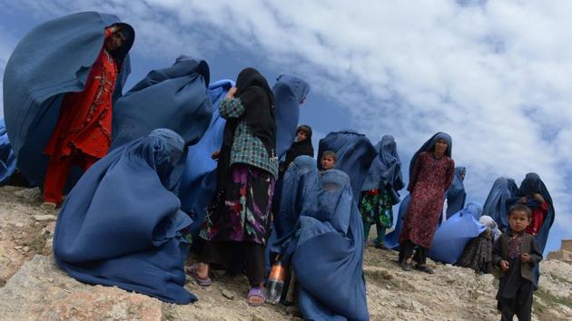 Afghan villagers are pictured near the scene in the landslide-hit Aab Bareek village in Argo district of Badakhshan province on May 5, 2014. Marai joined AFP as a driver in 1996, the year the Taliban seized power, and began taking pictures on the side, covering stories including the US invasion in 2001. (Shah Marai / AFP File) Afghan villagers are pictured near the scene in the landslide-hit Aab Bareek village in Argo district of Badakhshan province on May 5, 2014. Marai joined AFP as a driver in 1996, the year the Taliban seized power, and began taking pictures on the side, covering stories including the US invasion in 2001. (Shah Marai / AFP File)