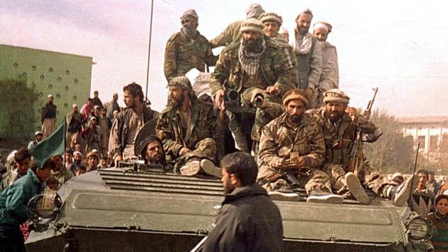 Security forces from the Northern Alliance group entering Kabul, during the fall of the Taliban regime on November 13, 2001. Marai was one of the few reporters to cover the bombing of Kabul ahead of the US invasion. (Shah Marai / AFP File) Security forces from the Northern Alliance group entering Kabul, during the fall of the Taliban regime on November 13, 2001. Marai was one of the few reporters to cover the bombing of Kabul ahead of the US invasion. (Shah Marai / AFP File)