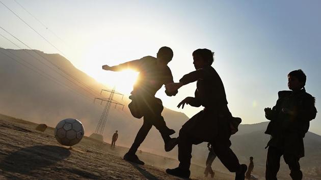 Afghan children play football in a field in Kabul on November 23, 2014. “We can only honour the extraordinary strength, courage, and generosity of a photographer who covered often traumatic, horrific events with sensitivity and consummate professionalism.” said Michèle Leridon, AFP Global News Director. (Shah Marai / AFP File) Afghan children play football in a field in Kabul on November 23, 2014. “We can only honour the extraordinary strength, courage, and generosity of a photographer who covered often traumatic, horrific events with sensitivity and consummate professionalism.” said Michèle Leridon, AFP Global News Director. (Shah Marai / AFP File)