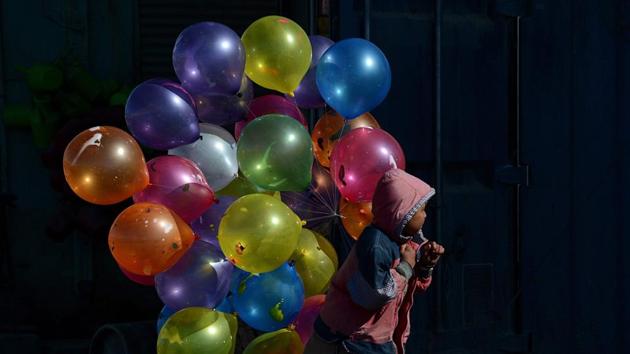 An Afghan boy walks with balloons for sale on a cold winter's day in Kabul on February 7, 2013. Marai’s versatility and easy camaraderie was demonstrated in a message moments before the second attack, in which he reassured an AFP video colleague who was stuck in traffic and could not reach the scene. “No worry man, I am here,” he said by WhatsApp. (Shah Marai / AFP File) An Afghan boy walks with balloons for sale on a cold winter's day in Kabul on February 7, 2013. Marai’s versatility and easy camaraderie was demonstrated in a message moments before the second attack, in which he reassured an AFP video colleague who was stuck in traffic and could not reach the scene. “No worry man, I am here,” he said by WhatsApp. (Shah Marai / AFP File)