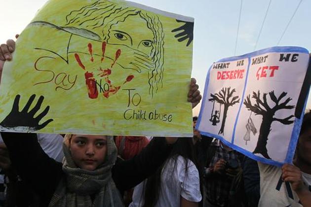 Activists and students hold placards during a protest in a silent candle march over the rape case in Jammu on April 13, 2018. (AFP) Activists and students hold placards during a protest in a silent candle march over the rape case in Jammu on April 13, 2018. (AFP)