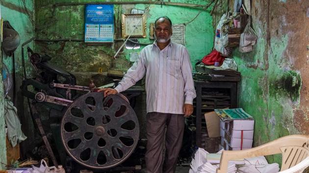 Syed Ahmed, 50, owns and operates a letterpress printing machine in Delhi, India. There are only five other such operators in the city according to Ahmed, who says he is the last one in his family working in the tradition. Growing out of the printing press invented by Johannes Gutenberg in the mid-15th century, Letterpress printing remained in wide use for book and newspaper production until overtaken by digital replacements. (Chandan Khanna / AFP)