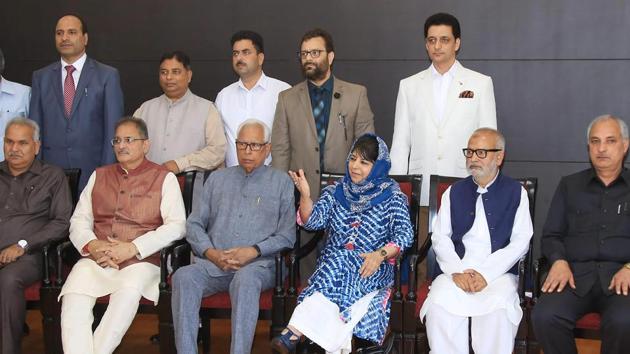 Jammu & Kashmir governor NN Vohra and chief minister Mehbooba Mufti pose for a photograph with newly appointed deputy chief minister Kavinder Gupta other cabinet ministers after a reshuffle in Jammu. (PTI) Jammu & Kashmir governor NN Vohra and chief minister Mehbooba Mufti pose for a photograph with newly appointed deputy chief minister Kavinder Gupta other cabinet ministers after a reshuffle in Jammu. (PTI)