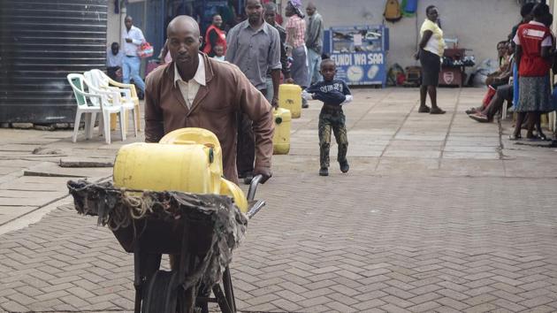 The lack of running water in Kenya’s poorest neighbourhoods has, for the last 18 years, meant a living for Samson Muli, a water seller in Nairobi. The margins are tiny -- he buys water at five shillings ($0.05) a can and sells for 15, but the job allows him to pay his children’s school fees on time. With Kenya’s gradual development, including piped water, Muli’s profitable days are numbered. (Simon Maina / AFP)