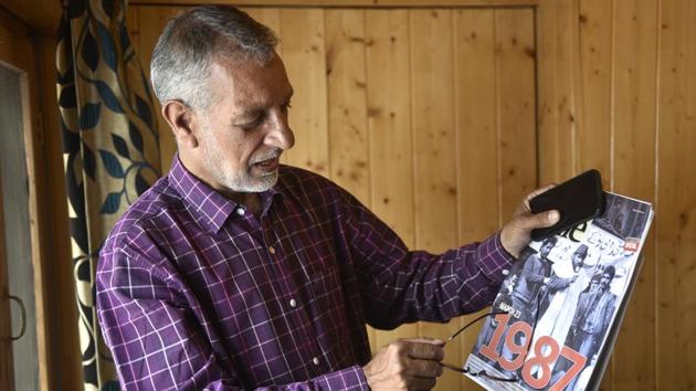 Meraj-ud-din of Associated Press (AP) shows a copy of the 2016 anniversary issue of Srinagar-based magazine Kashmir Life dedicated to the 1987 elections. In the late 80’s and early 90’s Meraj-ud-din, then with Reuters, photographed the watershed elections that, perceived in much of Kashmir to be rigged, drove its leaders and the generation that followed, away from the electoral process. (Ajay Aggarwal / HT Photo) Meraj-ud-din of Associated Press (AP) shows a copy of the 2016 anniversary issue of Srinagar-based magazine Kashmir Life dedicated to the 1987 elections. In the late 80’s and early 90’s Meraj-ud-din, then with Reuters, photographed the watershed elections that, perceived in much of Kashmir to be rigged, drove its leaders and the generation that followed, away from the electoral process. (Ajay Aggarwal / HT Photo)