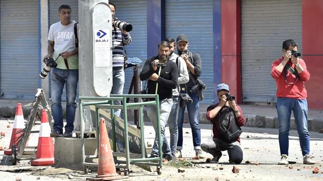 For the photographers reporting the conflict, their day begins and ends with looking for and clicking trouble. Most Kashmiri photographers work with local papers or with an international, or a national agency, updating the scene almost every hour. (Ajay Aggarwal / HT Photo) 