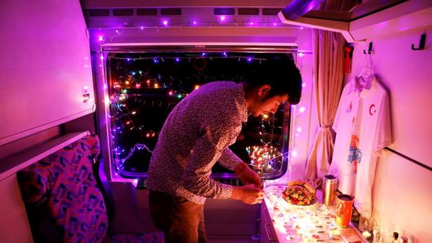 Not everyone, however, is making their dream journey. University student Sinan Usta, who decorated his cabin with candles and rainbow-coloured flashing lights for his girlfriend, spent the journey sitting alone in his little room. (Umit Bektas / REUTERS) Not everyone, however, is making their dream journey. University student Sinan Usta, who decorated his cabin with candles and rainbow-coloured flashing lights for his girlfriend, spent the journey sitting alone in his little room. (Umit Bektas / REUTERS)