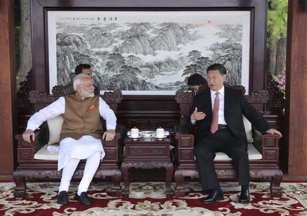 Prime Minister Narendra Modi and Chinese President Xi Jinping talk during a meeting in Wuhan in central China's Hubei Province, Saturday, April 28, 2018.(AP/File Photo)