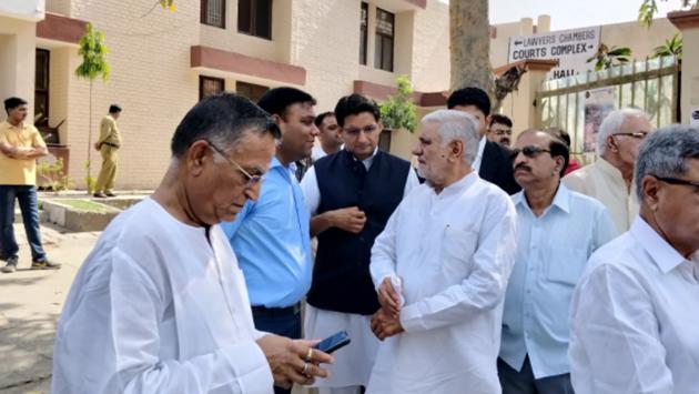 A battery of senior Congress leaders, including former Haryana Vidhan Sabha speaker Kuldeep Sharma, Karan Dalal, Anand Singh Dangi, Lalit Nagar, were present outside court complex in Panchkula on Tuesday. (HT Photo) A battery of senior Congress leaders, including former Haryana Vidhan Sabha speaker Kuldeep Sharma, Karan Dalal, Anand Singh Dangi, Lalit Nagar, were present outside court complex in Panchkula on Tuesday. (HT Photo)