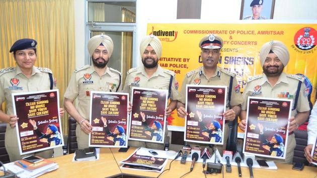 (From left) DCP Amrik Singh Powar; Amritsar police commissioner SS Srivastava; ADCP City­2, Lakhbir Singh; ADCP City­1, Jagjit Singh Walia and ACP Licensing for Amritsar City, Parvinder Kaur, releasing a poster of Punjabi sufi singer Satinder Sartaj’s event in the city on Monday.)(Sameer Sehgal/HT)