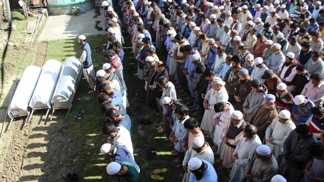 Kashmiri men pray during the funeral of three civilians identified as Asif Ahmad Sheikh, Haseeb Ahmad Khan and Muhammad Asghar, who were killed by militants on Monday afternoon in Baramulla, North Kashmir. Restrictions were imposed in parts of Srinagar, Pulwama and Kulgam today in view of a strike called by separatists to protest the killings. (HT Photo) Kashmiri men pray during the funeral of three civilians identified as Asif Ahmad Sheikh, Haseeb Ahmad Khan and Muhammad Asghar, who were killed by militants on Monday afternoon in Baramulla, North Kashmir. Restrictions were imposed in parts of Srinagar, Pulwama and Kulgam today in view of a strike called by separatists to protest the killings. (HT Photo)