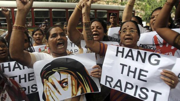 A file photo, of Indian activists in Mumbai holding placards demanding rapists be hanged(AP)