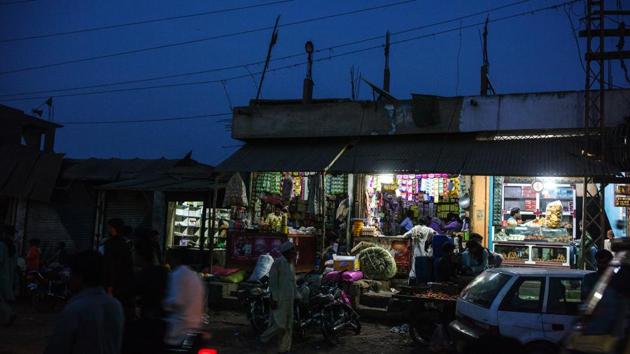 Stores stands illuminated by solar-powered bulbs seen in Sujawal’s marketplace. Global solar panel prices have plummeted in the last five years and units ranging in size from 50 watts to 200 watts, powering fans and lights are available even in the poorest regions for 1,000 rupees to 3,000 rupees a month, according to distributors EcoEnergy and Nizam Energy. (Asim Hafeez / Bloomberg) Stores stands illuminated by solar-powered bulbs seen in Sujawal’s marketplace. Global solar panel prices have plummeted in the last five years and units ranging in size from 50 watts to 200 watts, powering fans and lights are available even in the poorest regions for 1,000 rupees to 3,000 rupees a month, according to distributors EcoEnergy and Nizam Energy. (Asim Hafeez / Bloomberg)