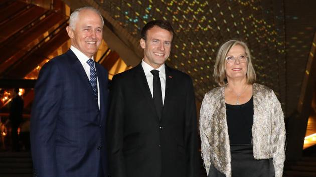 France's President Emmanuel Macron (C) poses for a photo with Australia's Prime Minister Malcolm Turnbull (L) and his wife Lucy Turnbull (R) outside the Sydney Opera House in Sydney on May 1, 2018.(AFP)