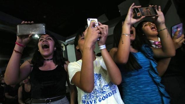 K-Pop fans cheer for the Rough Bunnies during a performance in Santiago. The winners of the preliminary rounds across countries will stand for chances to qualify for a trip to the K-Pop World Festival in Changwon later in October. (Claudio Reyes / AFP)