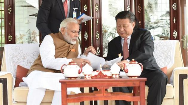 Prime Minister Narendra Modi and Chinese President Xi Jinping sit as they take a boat ride on the East Lake in Wuhan in China on April 28, 2018.(Reuters Photo)