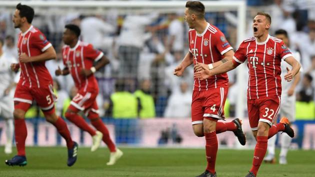 Bayern Munich midfielder Joshua Kimmich (R) gave his team the lead against Real Madrid to level scores on aggregate. (AFP) Bayern Munich midfielder Joshua Kimmich (R) gave his team the lead against Real Madrid to level scores on aggregate. (AFP)