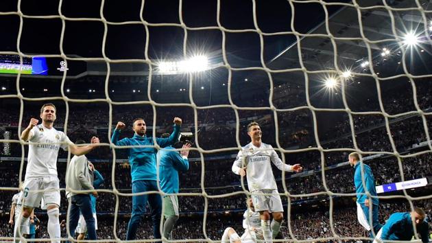 Real Madrid players celebrate at the end of the UEFA Champions League semi-final second leg football match against Bayern Munich and making it to final for a third consecutive year. (AFP)