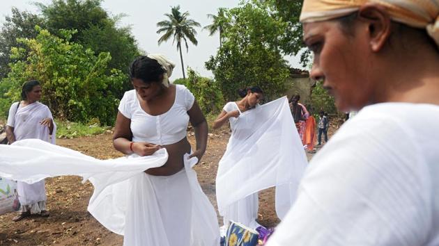 The thali and ornaments are discarded, replaced with the white saris of widowhood and mourning. And just as Mohini mourned the death of her husband, the transgender widows of Aravan also grieve, their wails contrasting the festivities from just a day before. (Arun Sankar / AFP)