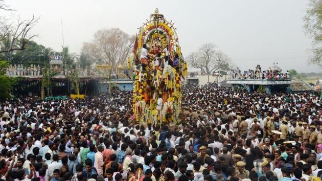 Devotees gather to take part in a ritual procession of pulling the statue of Aravan on a chariot. With no takers for a marriage that would bring immediate widowhood, Krishna agrees to takes the form of a woman, Mohini and fulfils Aravan’s condition. (Arun Sankar / AFP)