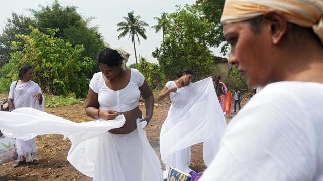Transgender devotees dress in white saris after a ritual signifying their marriage to the warrior god Aravan at the Koothandavar Temple in the village of Koovagam, Tamil Nadu. Devotees from all over India gather at the Koothandavar Temple each year during the full moon of the Tamil month of Chitrai, to participate in the re-enactment of a tale of the epic Mahabharata. (Arun Sankar / AFP) Transgender devotees dress in white saris after a ritual signifying their marriage to the warrior god Aravan at the Koothandavar Temple in the village of Koovagam, Tamil Nadu. Devotees from all over India gather at the Koothandavar Temple each year during the full moon of the Tamil month of Chitrai, to participate in the re-enactment of a tale of the epic Mahabharata. (Arun Sankar / AFP)