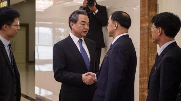 China's foreign minister Wang Yi (centre L) shakes hands with North Korea's vice foreign minister Ri Kil Song (centre R) after arriving at Pyongyang international airport on May 2, 2018.(AFP) China's foreign minister Wang Yi (centre L) shakes hands with North Korea's vice foreign minister Ri Kil Song (centre R) after arriving at Pyongyang international airport on May 2, 2018.(AFP)