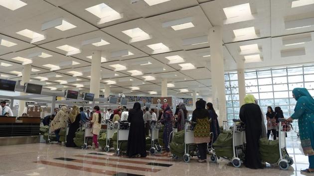 Pakistani airport official take part in a test rehearsal at the new Islamabad International Airport ahead of its official opening on the outskirts of Islamabad.(AFP Photo)