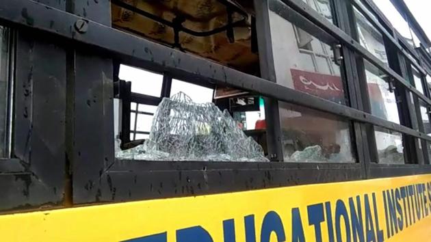 The damaged school bus which was attacked by stone-pelters at Zavoora area in Shopian district of south Kashmir on Wednesday.(PTI) The damaged school bus which was attacked by stone-pelters at Zavoora area in Shopian district of south Kashmir on Wednesday.(PTI)
