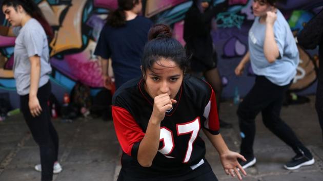 Across Chile, parks and cultural centers have come alive with the catchy melodies of K-pop as teens embrace this wildly popular South Korean mix of upbeat electronic music and high-voltage choreography. “We get together to rehearse several days a week,” said Alicia, adding all the group wants to do is dance. (Claudio Reyes / AFP)