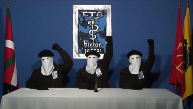 Three ETA militants dressed in black shirts with white hoods and black berets making a declaration from an undisclosed location.(AFP photo) Three ETA militants dressed in black shirts with white hoods and black berets making a declaration from an undisclosed location.(AFP photo)