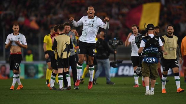 Liverpool FC's Dutch defender Virgil van Dijk (C) celebrates following their aggregate win. (AFP) Liverpool FC's Dutch defender Virgil van Dijk (C) celebrates following their aggregate win. (AFP)