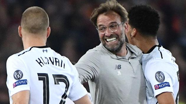 Liverpool FC manager Jurgen Klopp (C) celebrates with his players after their aggregate win over AS Roma in the Champions League on Wednesday. (AFP) Liverpool FC manager Jurgen Klopp (C) celebrates with his players after their aggregate win over AS Roma in the Champions League on Wednesday. (AFP)