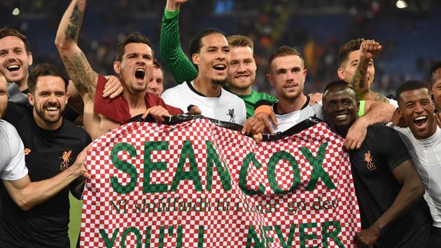Liverpool's Dutch defender Virgil van Dijk (C) and teammates hold a tribute to Liverpool fan Sean Cox. (AFP) Liverpool's Dutch defender Virgil van Dijk (C) and teammates hold a tribute to Liverpool fan Sean Cox. (AFP)