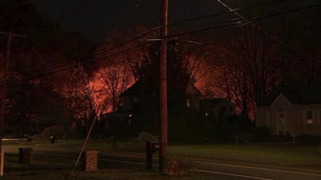 This image provided by WFSB-TV shows a fire behind a house in North Haven, Conn., Wednesday, May 2, 2018. (AP) This image provided by WFSB-TV shows a fire behind a house in North Haven, Conn., Wednesday, May 2, 2018. (AP)
