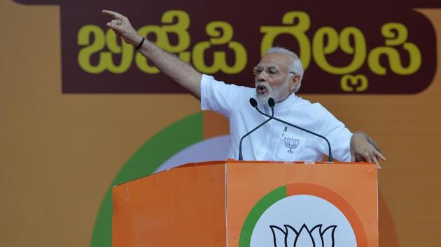 Prime Minister Narendra Modi gestures to supporters during an election campaign rally in Bangalore on May 3.(AFP Photo) Prime Minister Narendra Modi gestures to supporters during an election campaign rally in Bangalore on May 3.(AFP Photo)